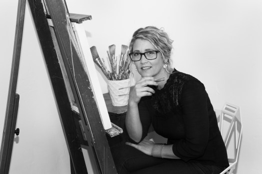 Tasha 2160 at easel black shirt chin in hand BW edited